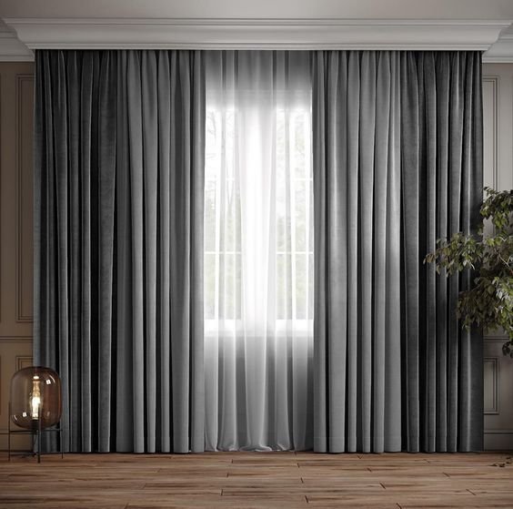 Grey floor-length curtains with sheer white layer, designed for modern home furnishing to add elegance, privacy, and style to interiors.