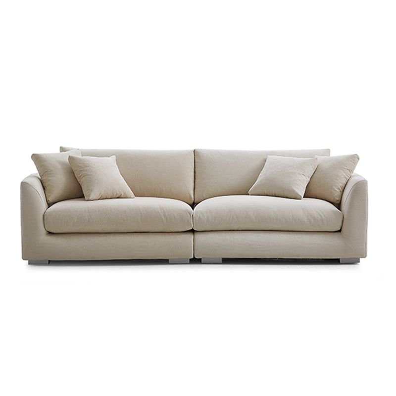 Beige fabric sofa with soft cushions, a stylish home furnishing piece designed for comfort, elegance, and modern living room interiors.